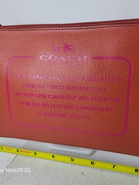 Coach Orange Leather Pouch with Pink Logo Print